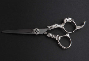 Mirage Reaper professional hairstylist scissor. On black background full view